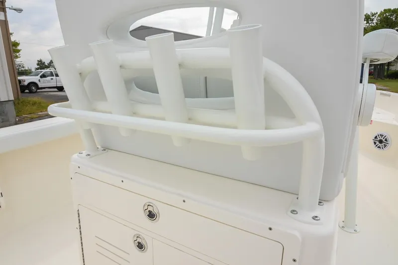 Slide: The Image of 2026 Pathfinder 2400 TRS boat with rod holders and storage compartment. - 19