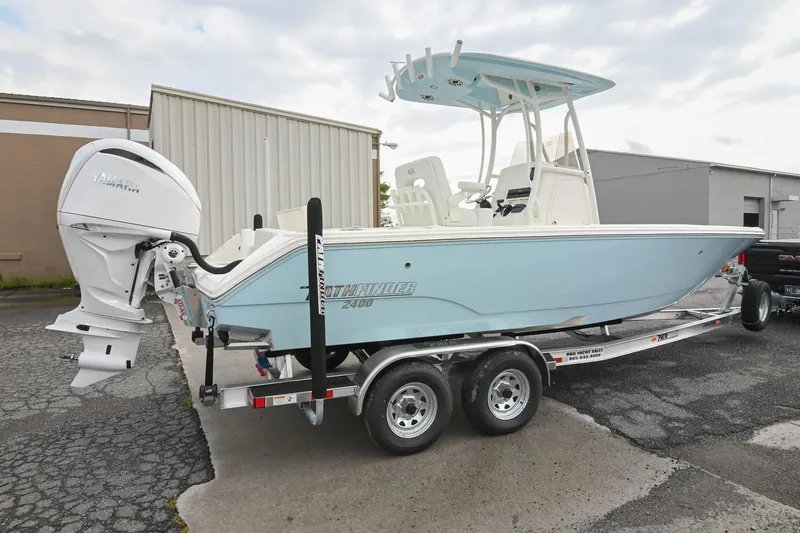 Slide: The Image of 2026 Pathfinder 2400 TRS boat on trailer, featuring Yamaha outboard motor. - 2