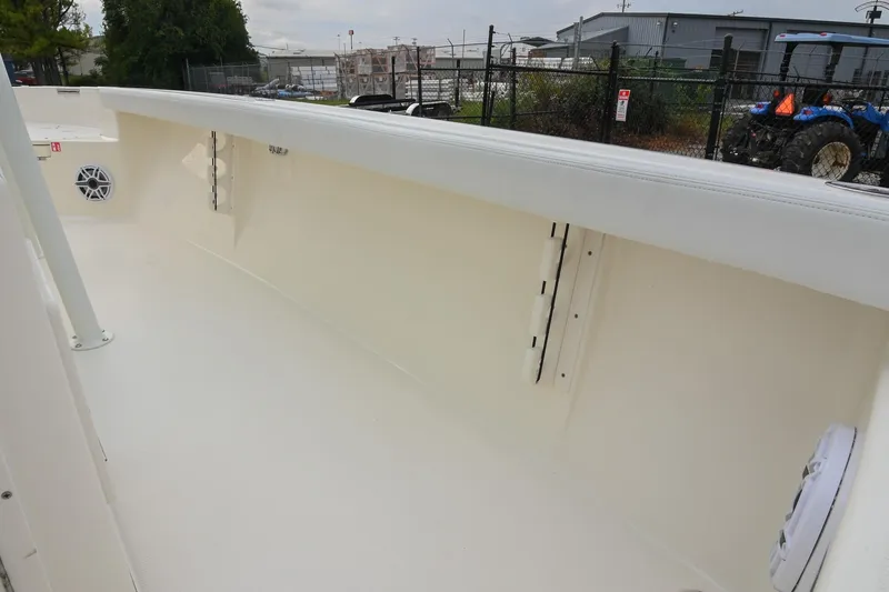 Slide: The Image of 2026 Pathfinder 2400 TRS boat interior, featuring clean white deck and speaker system. - 21