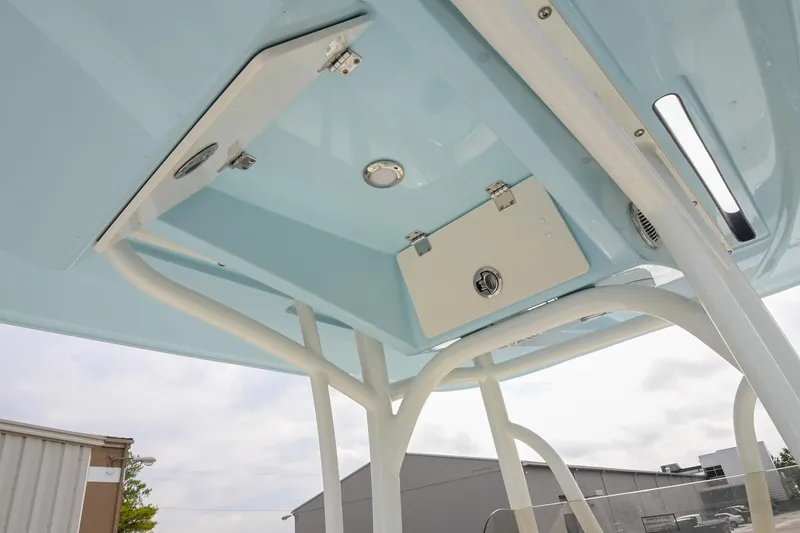 Slide: The Image of 2026 Pathfinder 2400 TRS boat T-top with storage compartment and lighting. - 24