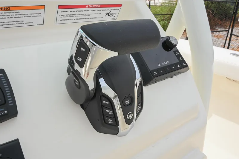 Slide: The Image of Close-up of 2026 Pathfinder 2400 TRS boat throttle control with JL Audio system. - 30