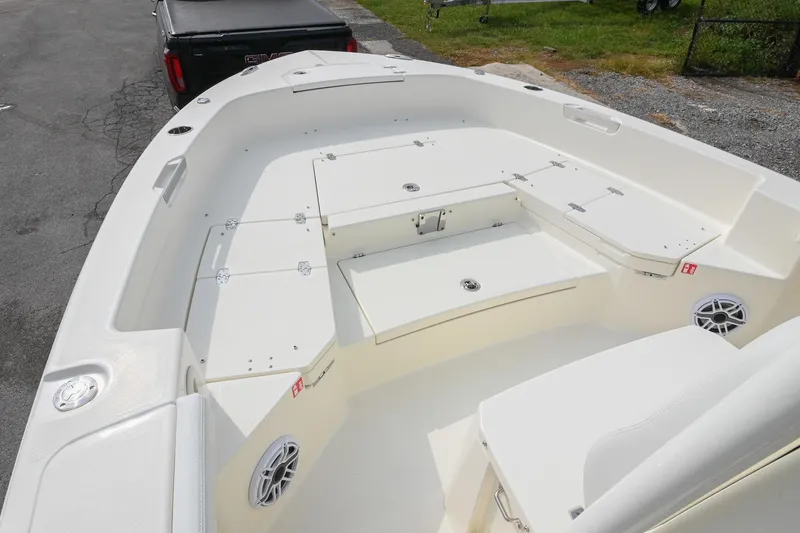 Slide: The Image of 2026 Pathfinder 2400 TRS boat interior with storage compartments and seating. - 33