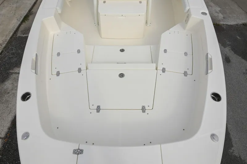 Slide: The Image of 2026 Pathfinder 2400 TRS boat interior with storage compartments and seating area. - 34