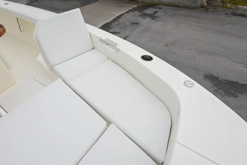 Slide: The Image of 2026 Pathfinder 2400 TRS boat interior with white cushioned seating. - 40