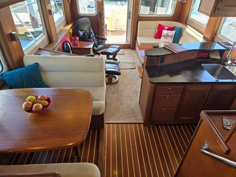Slide: The Image of Luxurious interior of a 2010 American Tug 49 Limited yacht with elegant wood finishes. - 3