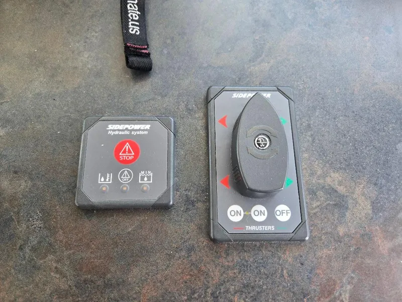 Slide: The Image of Dockmate remote control on American Tug 49 Limited, 2010 model, with joystick and strap. - 40