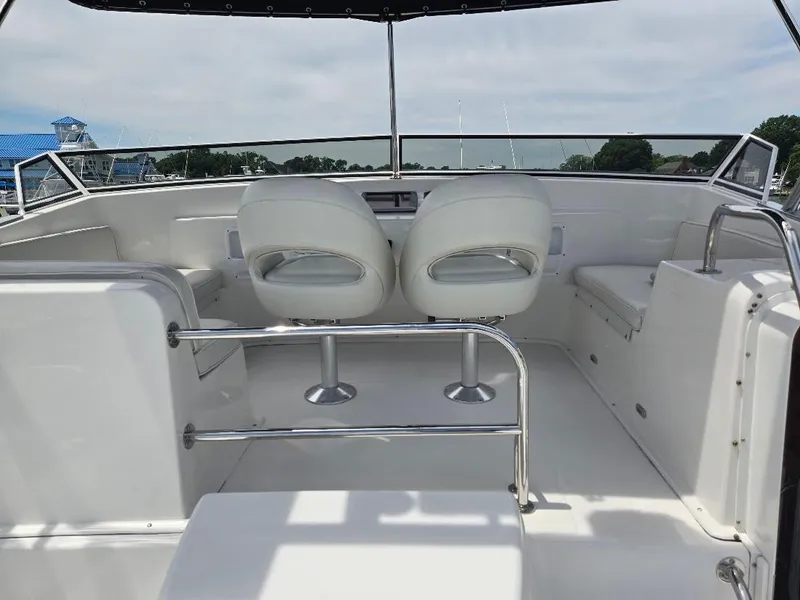 Slide: The Image of Cockpit of 2010 American Tug 49 Limited with navigation screens and marina view. - 9