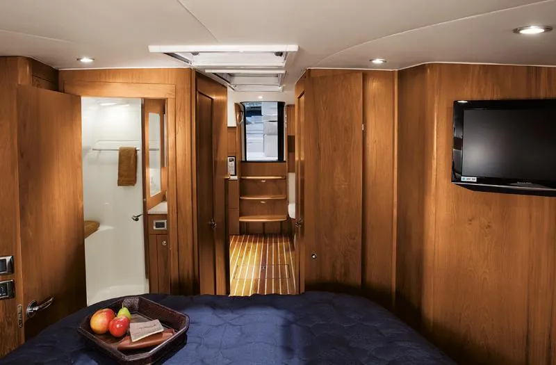 Slide: The Image of Manufacturer Provided Image: Luxurious interior of 2016 Tiara Yachts 4300 Open with wood paneling and modern amenities. - 10