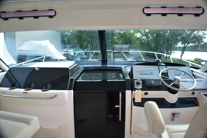 Slide: The Image of Helm of 2016 Tiara Yachts 4300 Open with Garmin navigation system. - 22