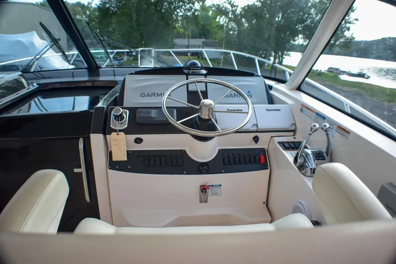 Slide: The Image of Helm of 2016 Tiara Yachts 4300 Open with Garmin navigation system and Cummins controls. - 23