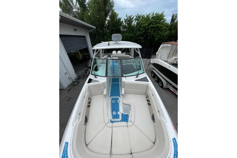 Slide: The Image of 2017 Boston Whaler 320 Vantage boat with spacious seating and sleek design. - 30