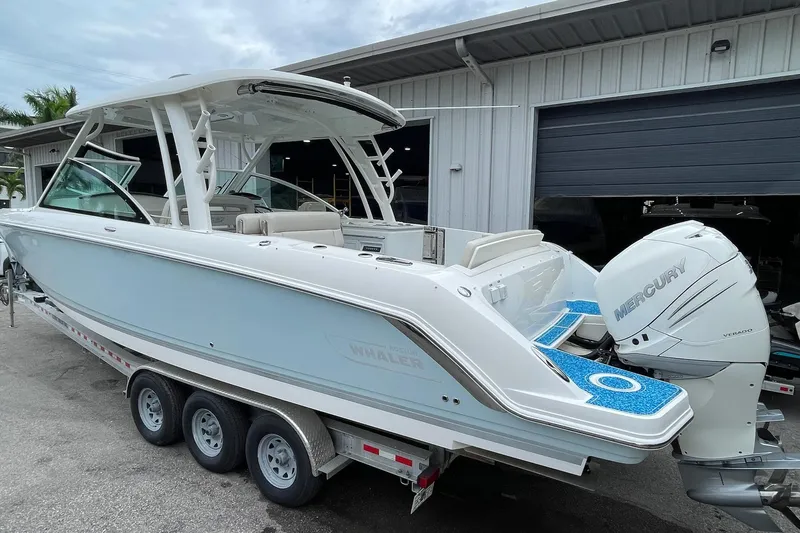 Slide: The Image of 2017 Boston Whaler 320 Vantage boat with Mercury engines on a trailer. - 5