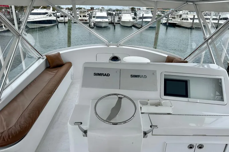 Slide: The Image of 2000 Custom Carolina Precision Sportfish helm with Simrad electronics, docked at marina. - 11