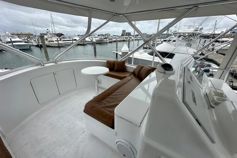 Slide: The Image of Luxurious 2000 Custom Carolina Precision Sportfish yacht interior with leather seating and marina view. - 12