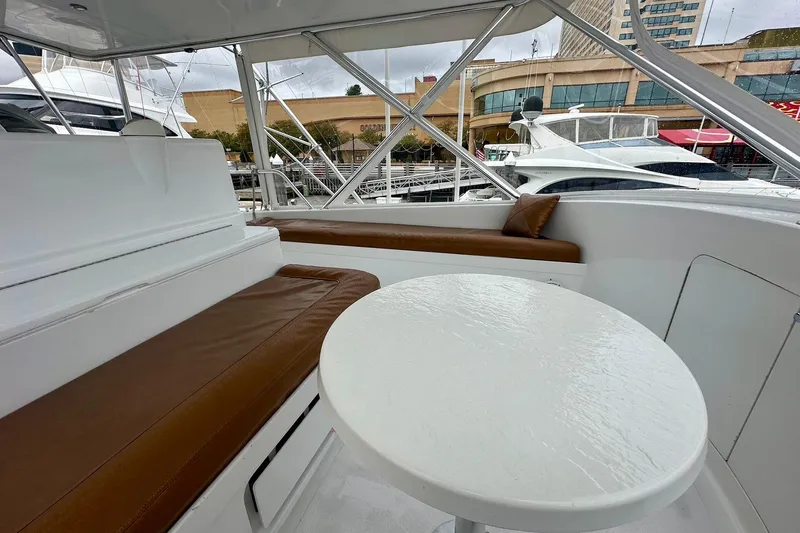 Slide: The Image of Interior of 2000 Custom Carolina Precision Sportfish with white table and brown seating. - 14