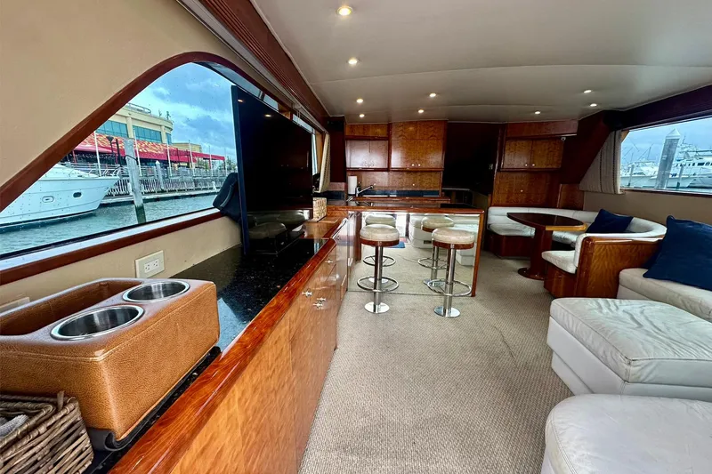 Slide: The Image of Luxurious interior of 2000 Custom Carolina Precision Sportfish yacht with modern seating and large windows. - 17