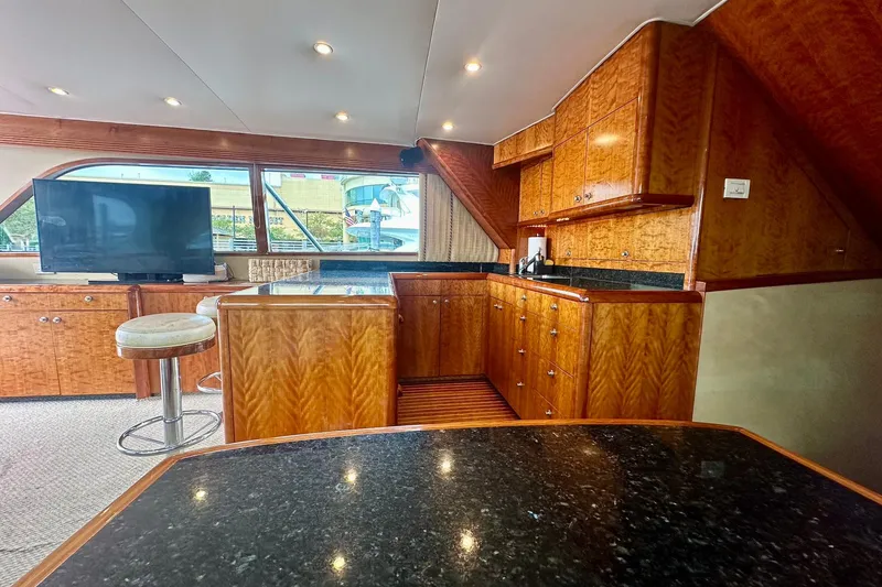Slide: The Image of Luxurious interior of 2000 Custom Carolina Precision Sportfish with wood cabinetry and modern amenities. - 18