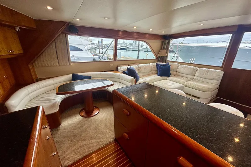 Slide: The Image of Luxurious interior of 2000 Custom Carolina Precision Sportfish yacht with plush seating and elegant design. - 19