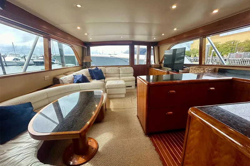 Slide: The Image of Luxurious interior of 2000 Custom Carolina Precision Sportfish yacht with plush seating and elegant wood finishes. - 20