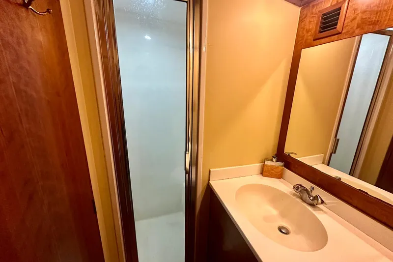 Slide: The Image of Bathroom interior of 2000 Custom Carolina Precision Sportfish with shower and sink. - 27