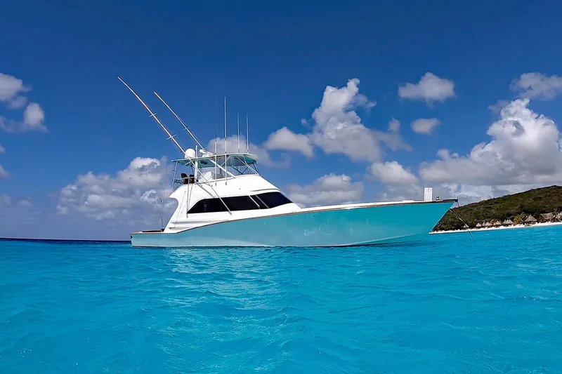 Slide: The Image of Custom Carolina Precision Sportfish 2000 boat on clear blue water under a bright sky. - 3