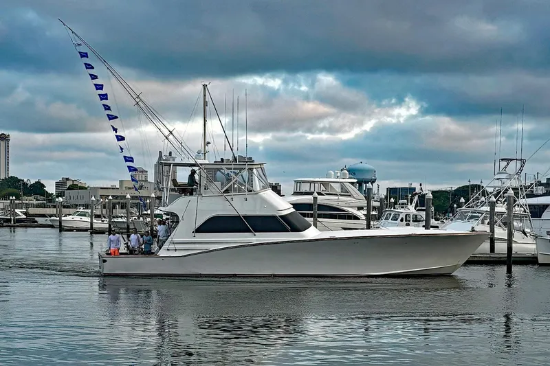 Slide: The Image of Custom Carolina Precision Sportfish 2000 yacht docked at marina under cloudy sky. - 7