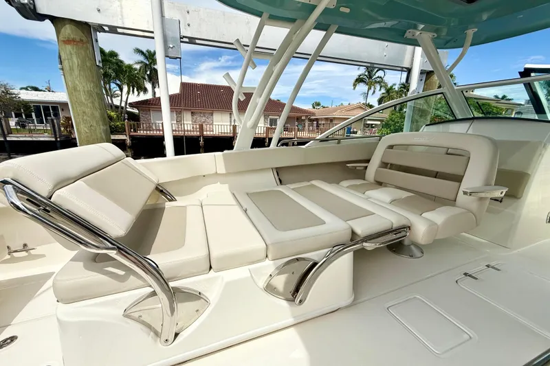 Slide: The Image of 2024 Boston Whaler 320 Vantage boat interior with luxurious seating and sleek design. - 14