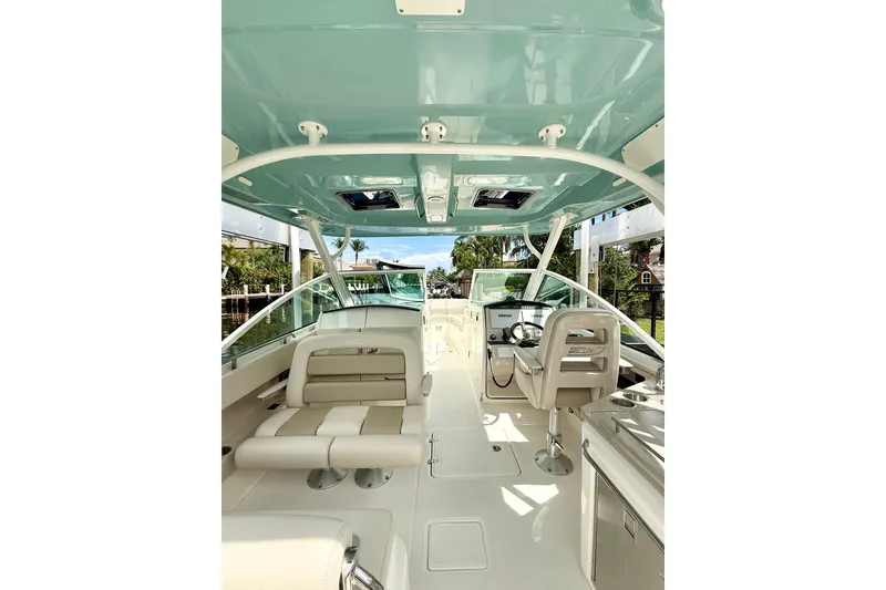 Slide: The Image of 2024 Boston Whaler 320 Vantage boat interior with seating and helm, featuring a sleek design. - 8