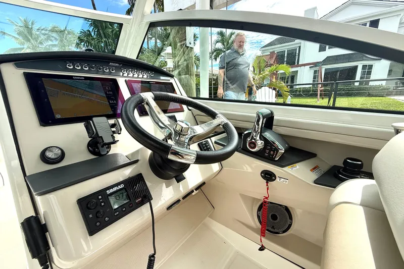 Slide: The Image of 2024 Boston Whaler 320 Vantage helm with advanced navigation and control systems. - 9