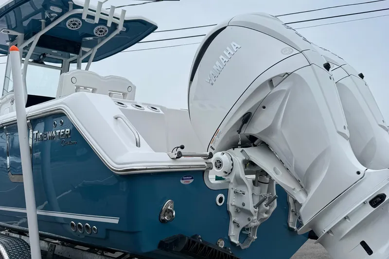 Slide: The Image of 2026 Tidewater 282 CC Adventure boat on trailer, showcasing rear hull and components. - 12