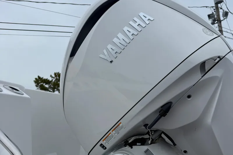 Slide: The Image of Helm of 2026 Tidewater 282 CC Adventure boat with steering wheel and control panel. - 14