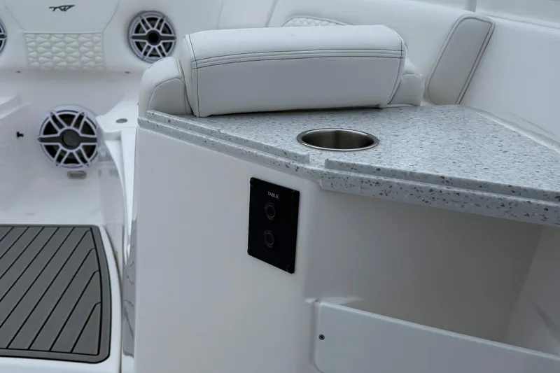 Slide: The Image of Anchor compartment of 2026 Tidewater 282 CC Adventure boat, featuring chain and storage. - 23