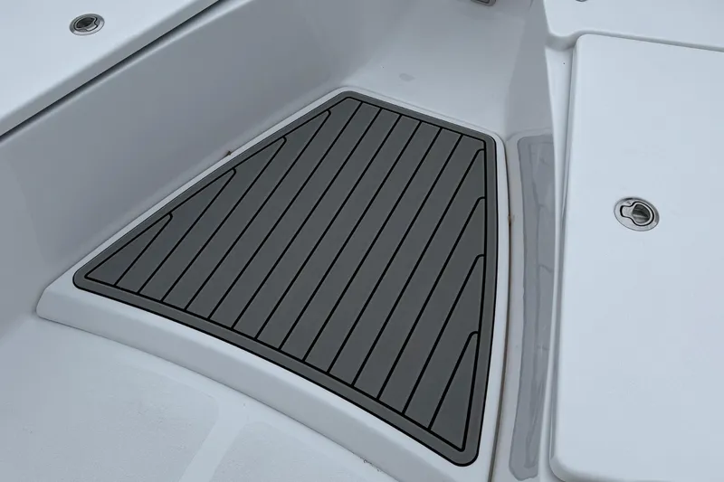 Slide: The Image of 2026 Tidewater 282 CC Adventure boat helm with steering wheel and control panel. - 28