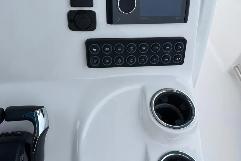 Slide: The Image of 2026 Tidewater 282 CC Adventure boat seating with white upholstery and armrests. - 29