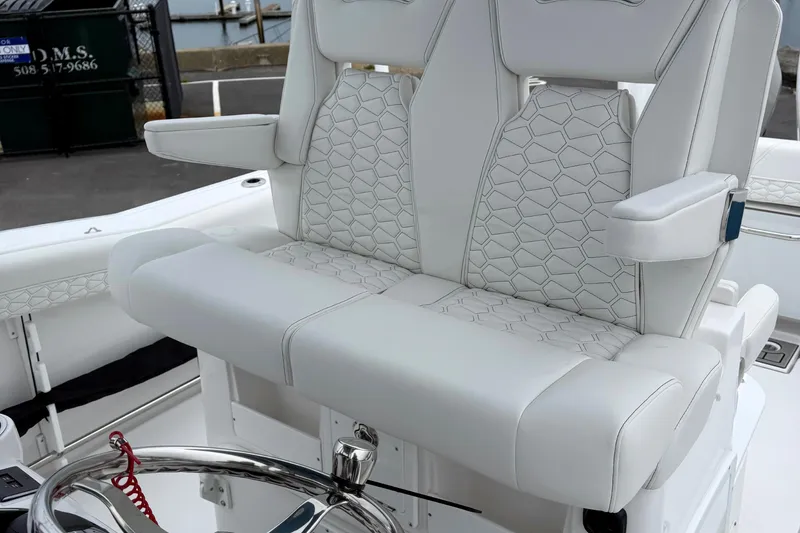 Slide: The Image of 2026 Tidewater 282 CC Adventure boat interior with sleek white seating and modern design elements. - 31
