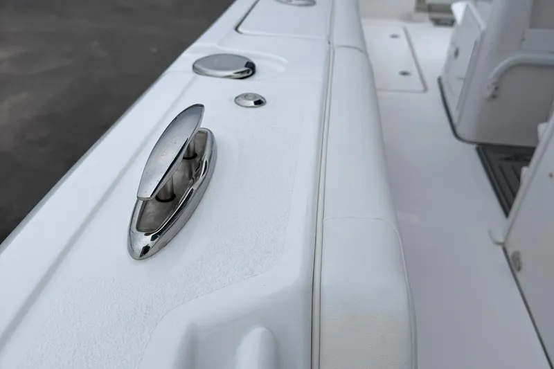 Slide: The Image of 2026 Tidewater 282 CC Adventure boat interior with control panel and branded flooring. - 32