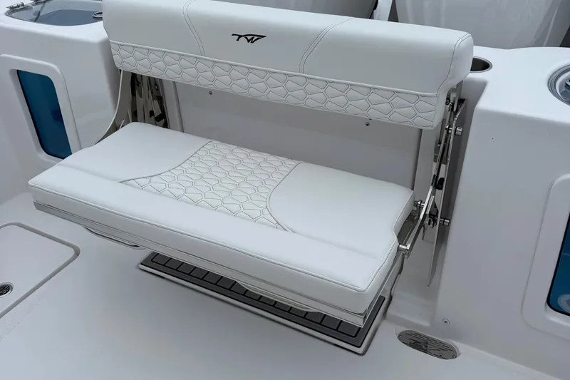 Slide: The Image of Battery compartment of 2026 Tidewater 282 CC Adventure boat with red cables. - 41