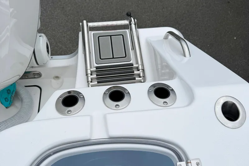 Slide: The Image of Livewell compartment on 2026 Tidewater 282 CC Adventure boat, featuring stainless steel hinges. - 45