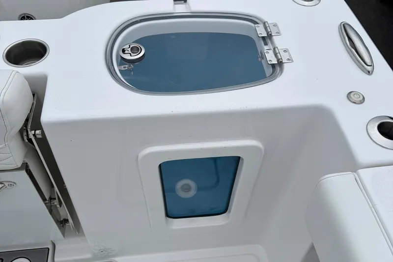 Slide: The Image of 2026 Tidewater 282 CC Adventure boat rod holders and speakers on deck. - 46