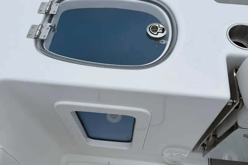 Slide: The Image of Boat tool storage on 2026 Tidewater 282 CC Adventure, featuring neatly organized equipment. - 47