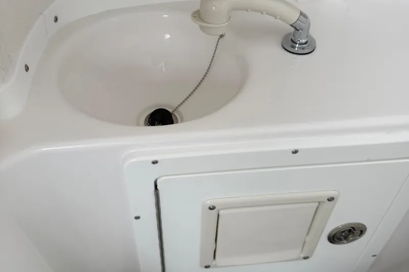 Slide: The Image of 2026 Tidewater 282 CC Adventure boat bathroom with sink and toilet. - 50