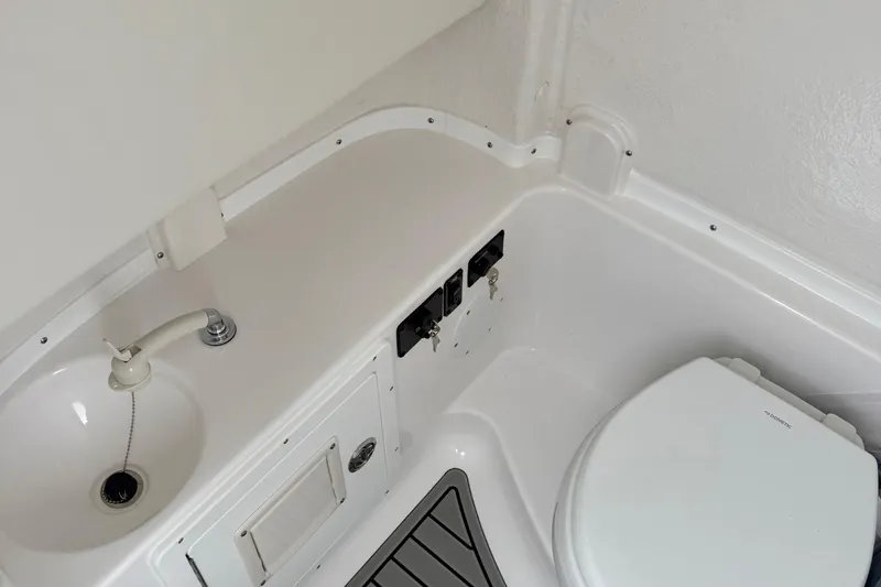 Slide: The Image of 2026 Tidewater 282 CC Adventure boat with dual Yamaha outboard engines. - 52