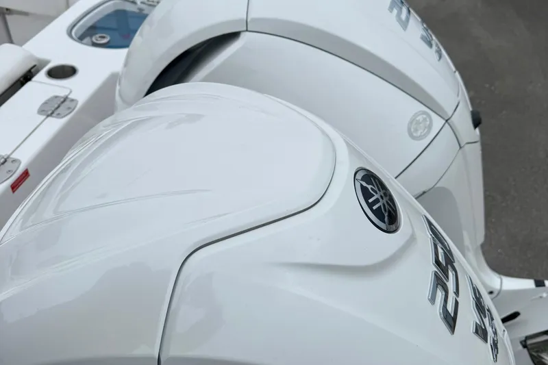 Slide: The Image of 2026 Tidewater 282 CC Adventure boat emblem on white surface. - 54