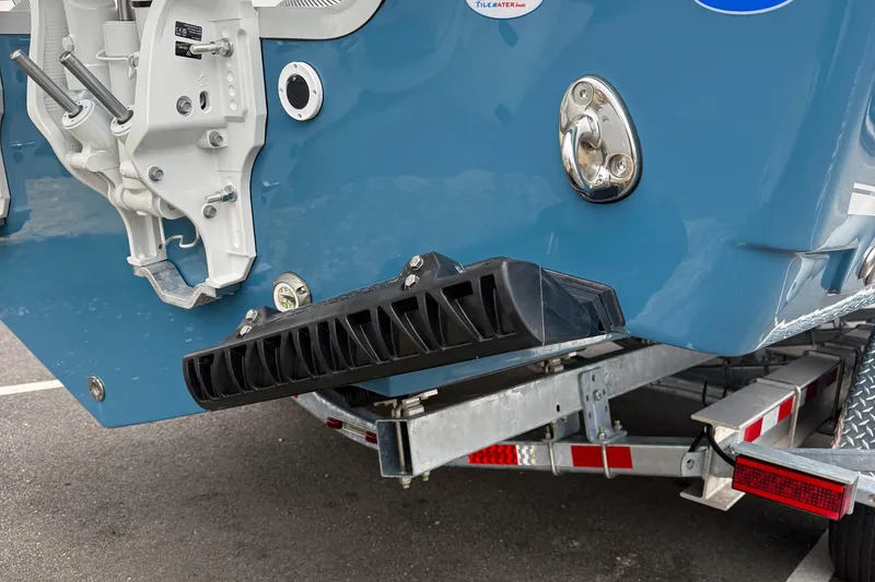 Slide: The Image of 2026 Tidewater 282 CC Adventure boat with Yamaha engines, featuring sleek blue and white design. - 9