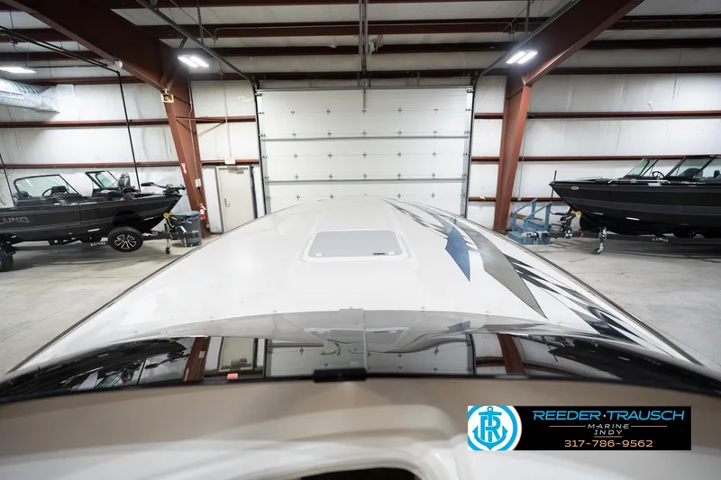 Slide: The Image of 2001 Nordic Heat 28 boat in a garage with other boats, Reeder-Trausch Marine logo visible. - 18