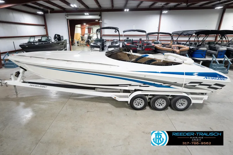 Slide: The Image of Nordic Heat 28 boat, 2001 model, displayed indoors on a trailer at Reeder-Trausch Marine. - 2