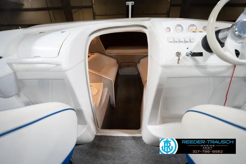 Slide: The Image of Interior view of 2001 Nordic Heat 28 boat cockpit with seating and control panel. - 24