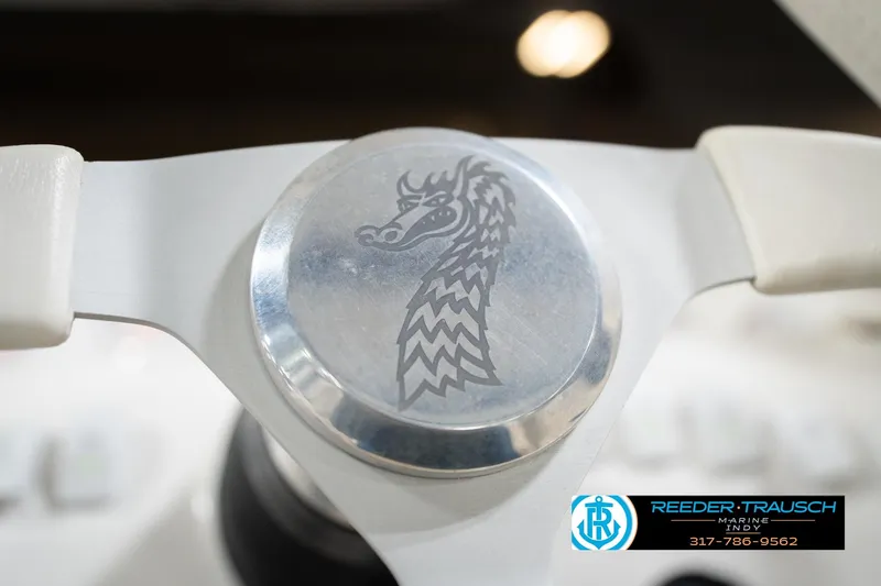 Slide: The Image of Steering wheel of 2001 Nordic Heat 28 boat with dragon emblem. - 30