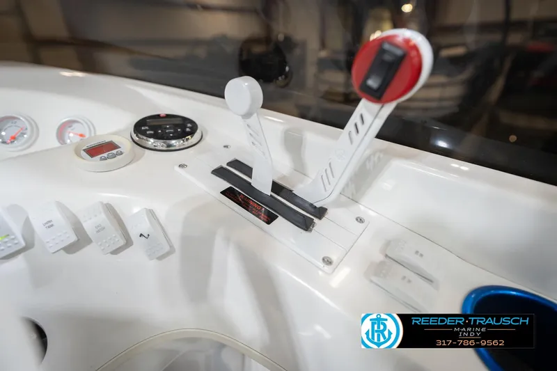 Slide: The Image of Control panel of a 2001 Nordic Heat 28 boat with throttle levers and gauges. - 40