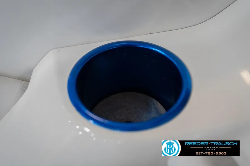 Slide: The Image of Close-up of a blue cup holder in a 2001 Nordic Heat 28 boat. - 42